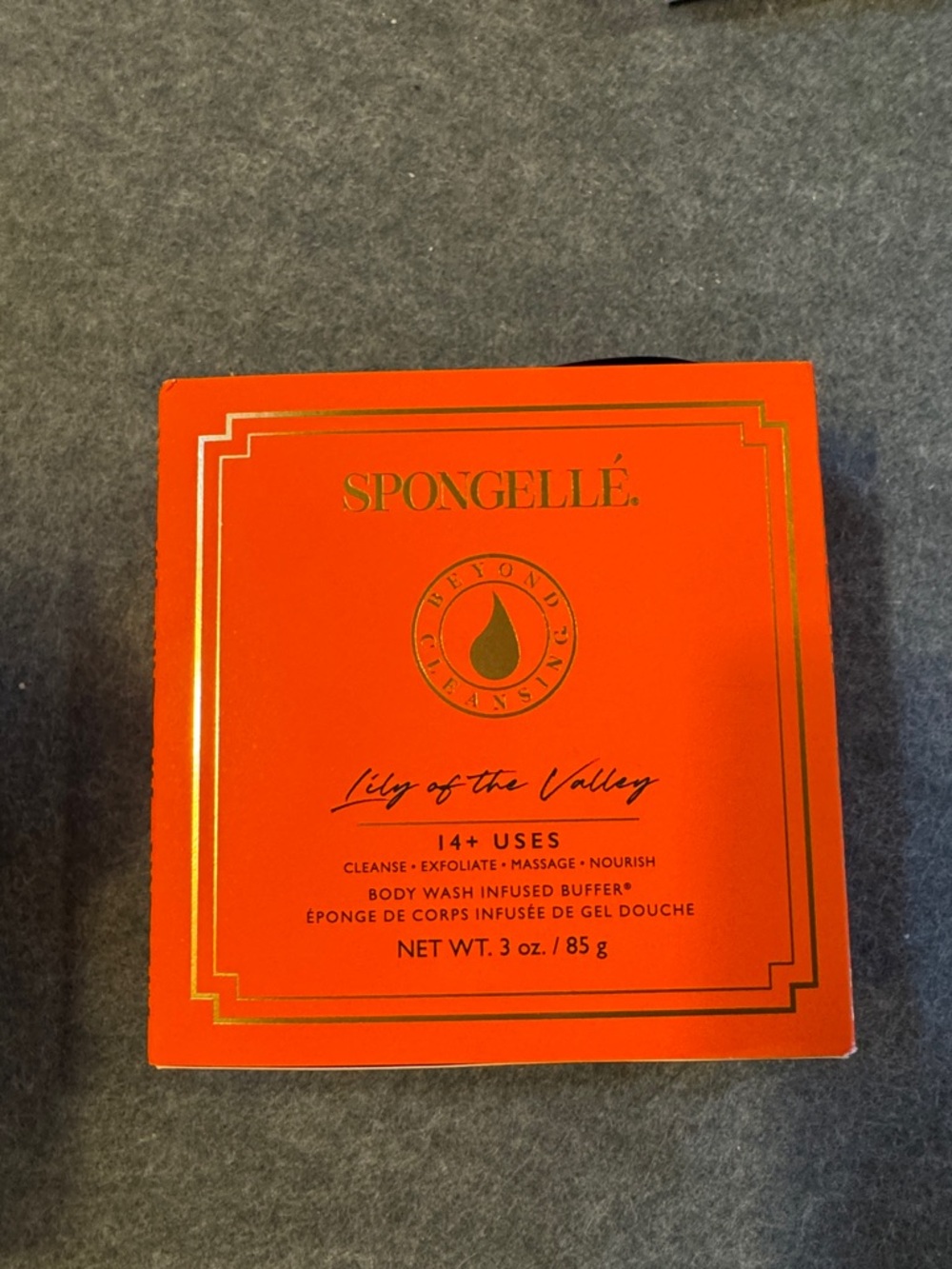 Spongellé Lily of the Valley Exfoliant & Scrub - Orange with Gold Accents